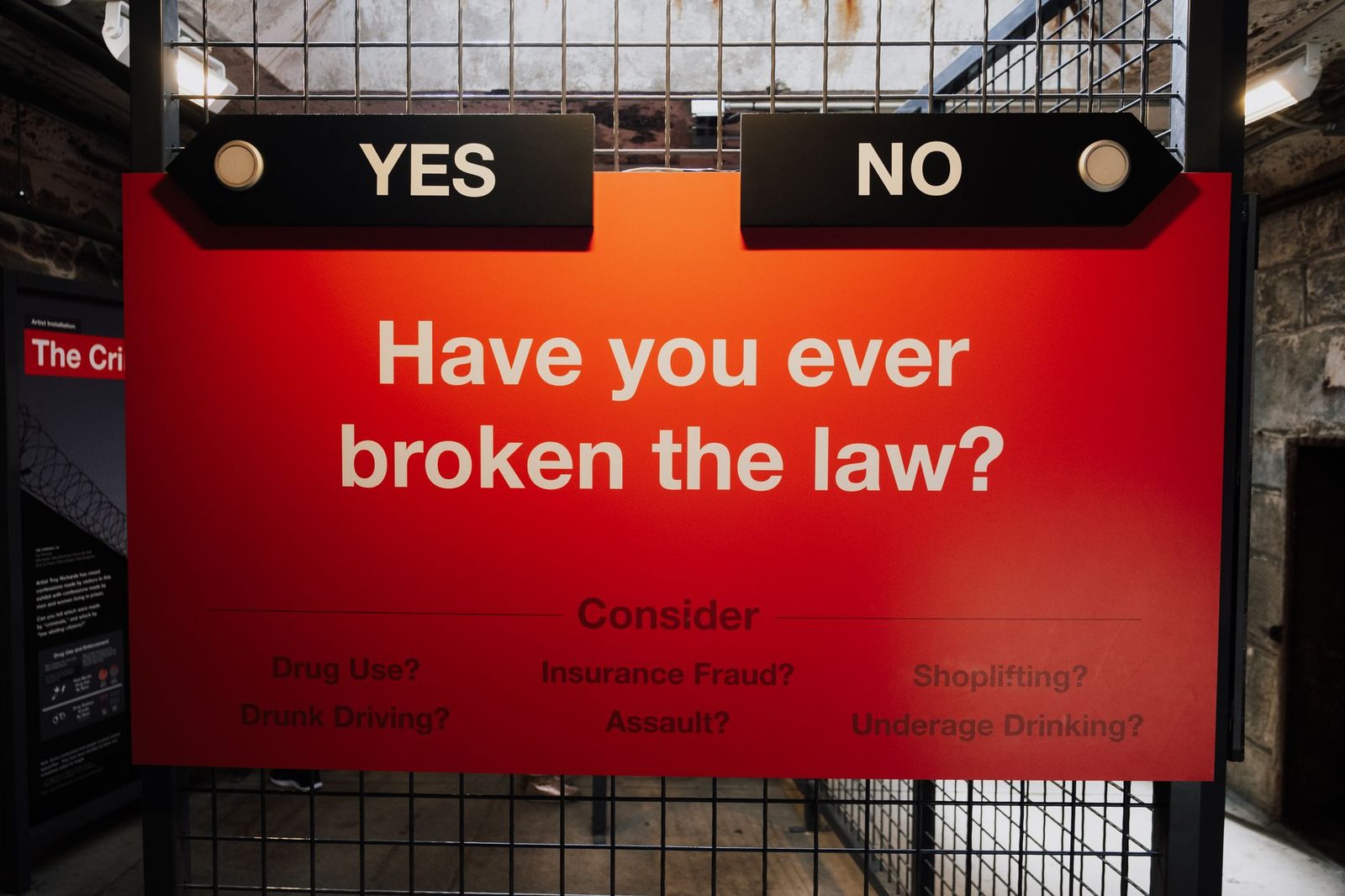 A red sign with yes and no options asks whether breaking laws, such as shoplifting or drug use, is acceptable.